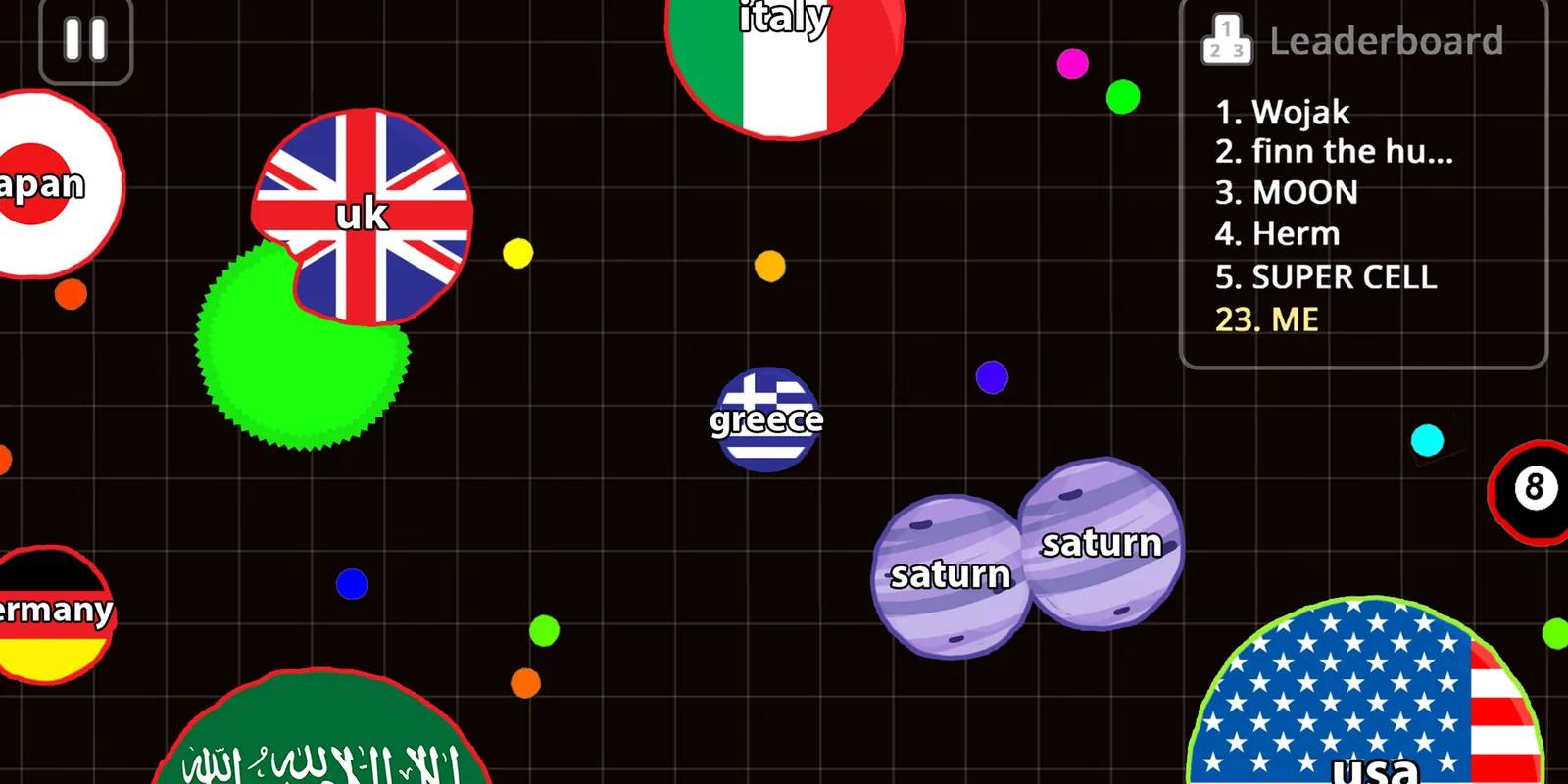 Agar.io screenshot: player cells with flag skins on a dark grid, with the leaderboard in the corner